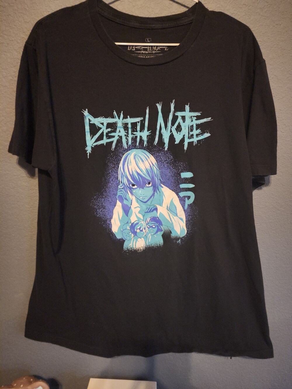 Death, note black T-shirt graphics.\nAsian inspired ripple junction , black blue